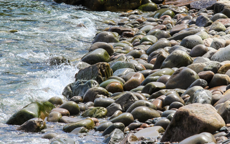 The Atlantic Ocean slaps against the rocky shoreline in Acadia National Park