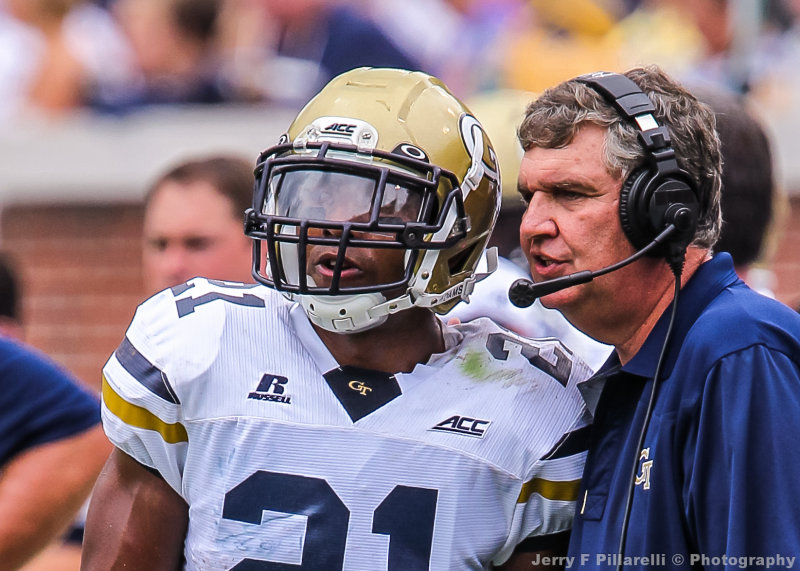 Georgia Tech Head Coach Paul Johnson sends in a play with A-back Perkins