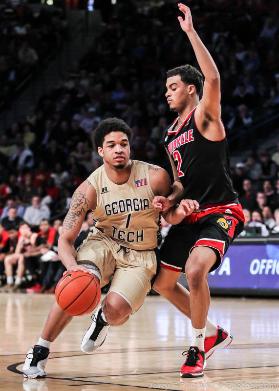 Jackets G Jackson moves around Cardinals G Quentin Snider