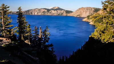 Shadows crawl over the west rim at sunset in Crater Lake National Park
