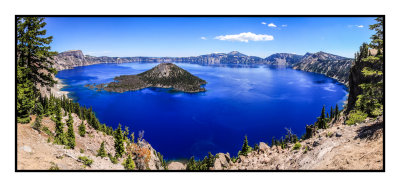 Wizard Island seemingly floating on a sheet of blue in Crater Lake National Park