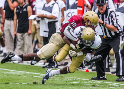 Georgia Tech WR BJ Bostic is brought down after the catch by Elon DB Julius Moore