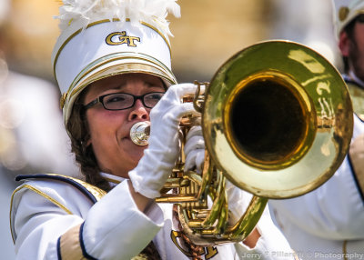 Georgia Tech Band member performs on the field at halftime