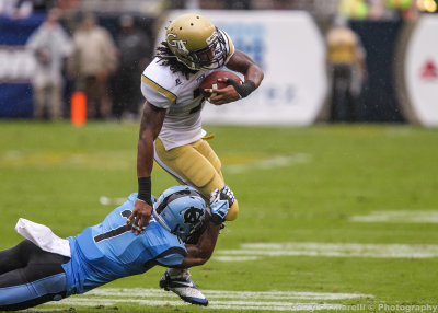 Tech A-back BJ Bostic is corralled in the open field by Heels CB Tim Scott