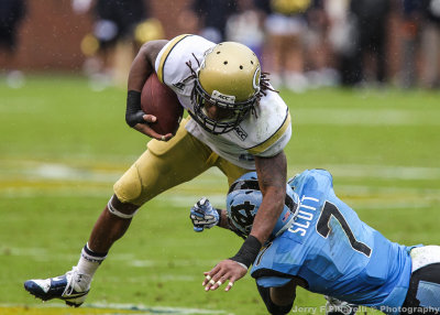GT A-back Bostic tries to get by NC CB Scott