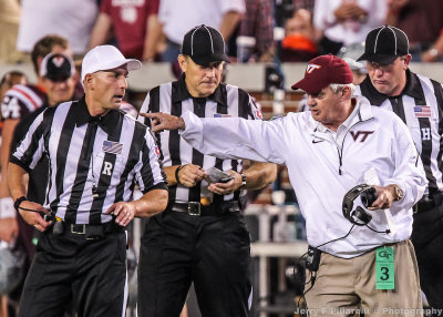 Virginia Tech Head Coach Frank Beamer talks to officials about a penalty against GT