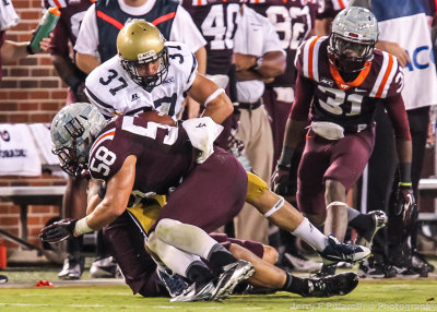 Yellow Jackets RB Zach Laskey is gang tackled after a gain
