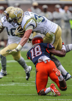 GT RB Laskey is upended by SU DB Darius Kelly