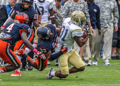 Tech A-back Hill is brought down in the open field by Cuse LB Hodge