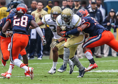 Tech DB RB Charles Perkins is hit by Syracuse LB Hodge