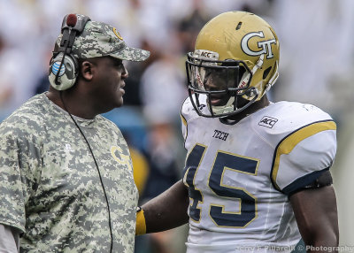 Jackets DE Attaochu discusses strategy with Defensive Line Coach Mike Pelton