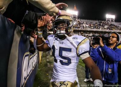 Georgia Tech WR Smelter celebrates with the students in the north end zone after the victory