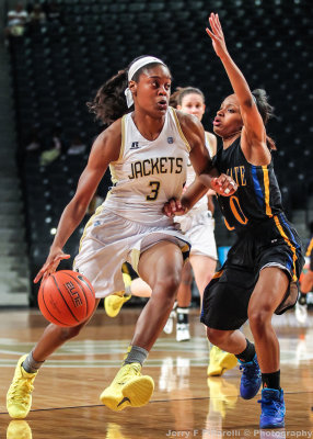 Georgia Tech G Davis drives around Coppin State G Griffin