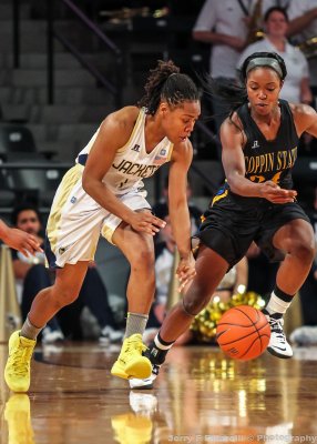 Yellow Jackets G Maye and Eagles F Bria Harris go after a loose ball