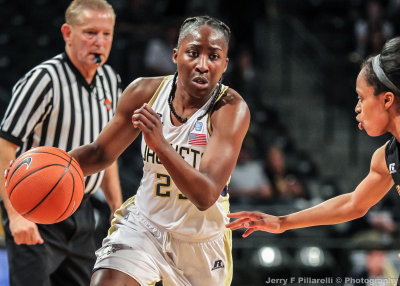 Yellow Jackets G Wallace drives toward the baseline