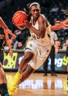 Jackets F Holston drives down a gap in the lane