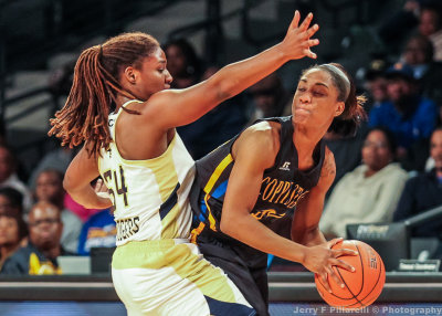 Jackets F Rogers traps Eagles F Kyra Coleman along the sidelines
