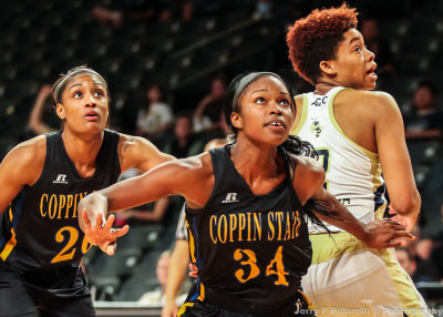 Coppin State F Carter and F Coleman box out Jackets F Whiteside