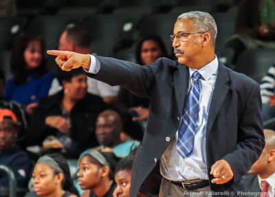 Coppin State Head Coach Derek Brown guides his team from the bench