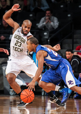 Yellow Jackets G Golden moves to get in front of Blue Hose G Will Adams