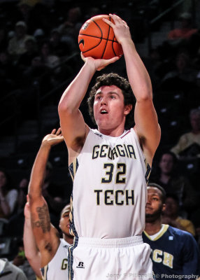 Yellow Jackets G Doyle puts up a three point shot