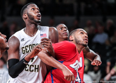 Jackets F Robert Carter Jr. fights for rebound position with Flyers F Jalen Robinson