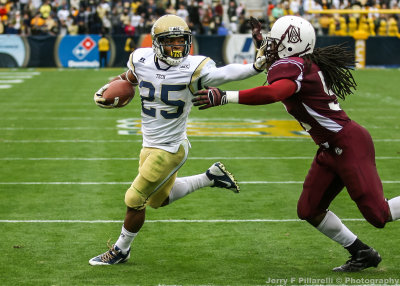 Georgia Tech AB Godhigh straight arms AAMU LB Robert Nelson…