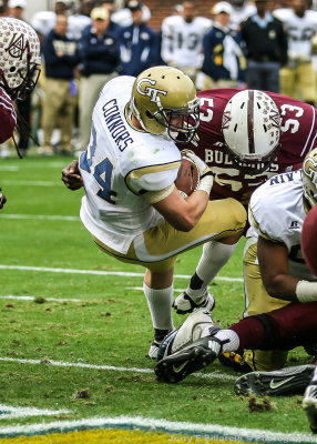 Jackets BB Matt Connors backs into the end zone for a score…