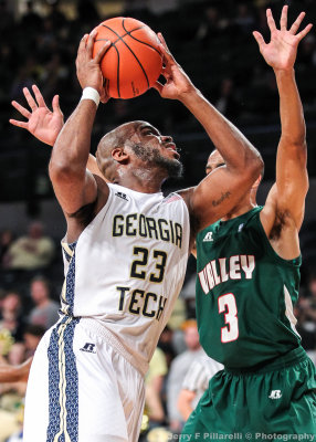 Yellow Jackets G Trae Golden scores over Delta Devils G Darryl Marshall