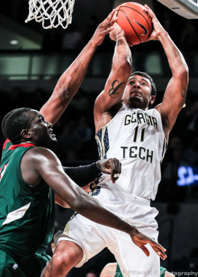 …Yellow Jackets G Bolden shoots over Delta Devils C Francis