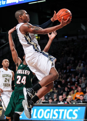 Tech F Marcus Georges-Hunt drives past Delta Devils G McDonald