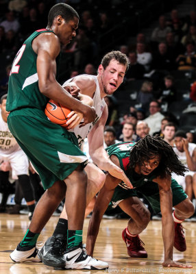 Georgia Tech C Daniel Miller works to gain possession of a loose ball