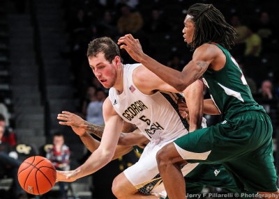 Jackets C Miller drives around Delta Devils F Currington