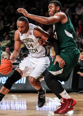 Yellow Jackets F Holsey drives by a Delta Devils defender