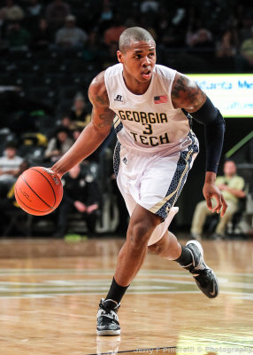 Tech F Marcus-Hunt dribbles at the top of the three point line