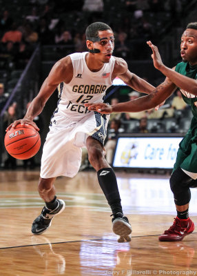 Jackets F Stephens is hassled by a Delta Devils defender
