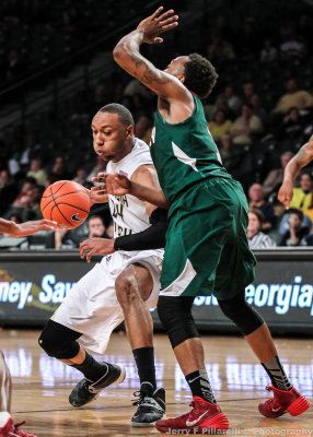 Yellow Jackets F Holsey drives into the lane around a Delta Devils defender