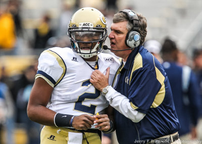 Georgia Tech Yellow Jackets Head Coach Paul Johnson gives the next play to QB Vad Lee 