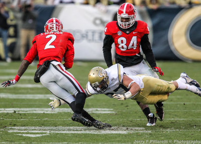 Yellow Jackets RB Zach Laskey tackles Bulldogs CB Dawson after an interception