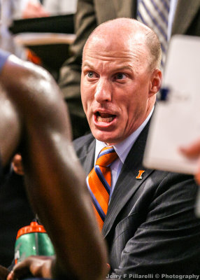 Illinois Fighting Illini Head Coach John Groce speaks to his team during a timeout