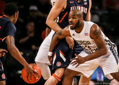 Jackets G Golden works to avoid a Fighting Illini pick while on defense