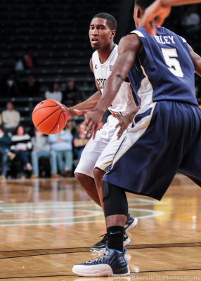 Jackets G Solomon Poole dribbles at the top of the key 