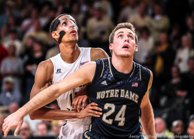 Jackets F Quinton Stevens positions himself for the rebound against Irish F Pat Connaughton