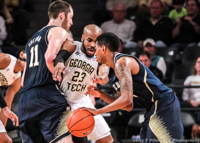 Georgia Tech G Trae Golden fights through the pick of Notre Dame C Sherman