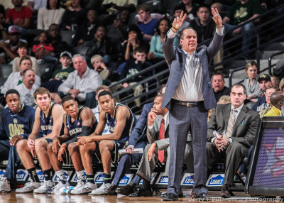 Notre Dame Fighting Irish Head Coach Mike Brey signals his team from the bench