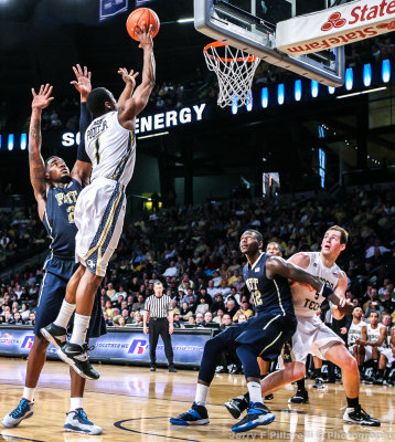 Georgia Tech G Stacey Poole Jr. scores a short jump shot over Pittsburgh F Young