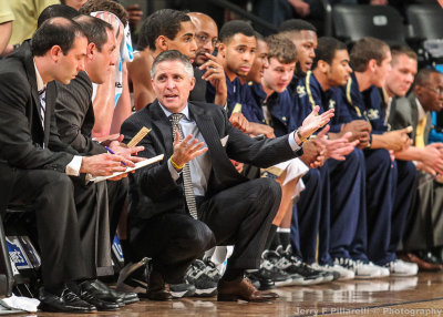 Georgia Tech Yellow Jackets Head Coach Brian Gregory consults his coaches during play