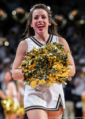 Georgia Tech Cheerleader performs during a break in the action