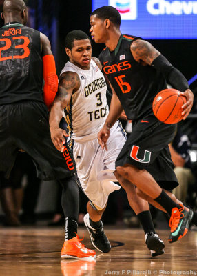 Tech F Georges-Hunt works to cover Miami G Rion Brown and avoid the pick by C Tonye Jekiri