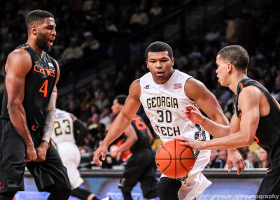 Yellow Jackets G Heyward moves up court with Hurricanes G Lecomte